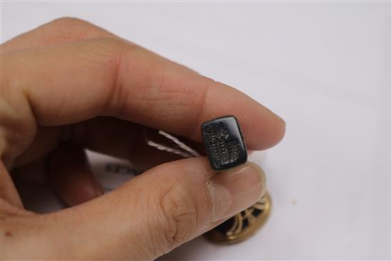 Three assorted seals including one with a purple-coloured intaglio matrix.